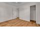 Neutral bedroom featuring hardwood floors, a closet and a view of the door at 908 Dogwood Dr, Gastonia, NC 28054