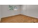 Neutral bedroom with a hardwood floors, window and closet at 908 Dogwood Dr, Gastonia, NC 28054