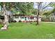 Charming single-story home with a well-maintained lawn and a basketball hoop in the front yard at 908 Dogwood Dr, Gastonia, NC 28054