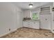 Functional kitchen with white cabinetry, dishwasher, and mosaic backsplash at 908 Dogwood Dr, Gastonia, NC 28054