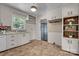 Functional kitchen with ample cabinet space and a view of the garage door at 908 Dogwood Dr, Gastonia, NC 28054