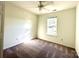 Cozy bedroom with a ceiling fan and natural light streaming in through the window at 9513 Isaac Hunter Dr, Charlotte, NC 28214