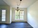 Inviting dining area featuring modern lighting and a large window at 9513 Isaac Hunter Dr, Charlotte, NC 28214