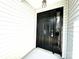 Stylish black front door with sidelight and modern exterior lighting at 9513 Isaac Hunter Dr, Charlotte, NC 28214
