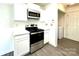 Modern kitchen featuring stainless steel appliances, white cabinets, and quartz countertops at 9513 Isaac Hunter Dr, Charlotte, NC 28214