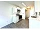 Modern kitchen with white cabinets, stainless steel appliances, and ample counter space at 9513 Isaac Hunter Dr, Charlotte, NC 28214