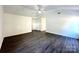 Spacious living room with vaulted ceilings and stylish flooring, perfect for entertaining at 9513 Isaac Hunter Dr, Charlotte, NC 28214
