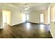 Open-concept living area with hardwood floors, great natural light, and access to the backyard at 9513 Isaac Hunter Dr, Charlotte, NC 28214