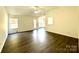 Spacious living room offering modern floors, neutral walls, and great natural light at 9513 Isaac Hunter Dr, Charlotte, NC 28214
