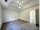 Spacious bedroom features plush carpet, ceiling fan, and ample natural light at 9513 Isaac Hunter Dr, Charlotte, NC 28214