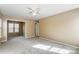 Large bedroom with beige walls and carpet, and a doorway to an adjacent room at 9900 Meadowmead Ct, Charlotte, NC 28273