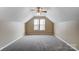 Neutral bedroom features cozy carpet and a vaulted ceiling with bright window at 9900 Meadowmead Ct, Charlotte, NC 28273