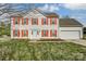 Charming two-story home with red shutters and a well-manicured front yard at 9900 Meadowmead Ct, Charlotte, NC 28273