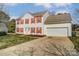 Charming two-story home with a two-car garage and red shutters at 9900 Meadowmead Ct, Charlotte, NC 28273