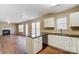 Open kitchen/living room area with fireplace, wood floors, and stainless steel appliances at 9900 Meadowmead Ct, Charlotte, NC 28273