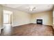 Spacious living room with a fireplace and wood-look floors, perfect for gatherings at 9900 Meadowmead Ct, Charlotte, NC 28273