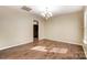 Light-filled living room with stylish chandelier and hardwood floors, creating an inviting space at 9900 Meadowmead Ct, Charlotte, NC 28273
