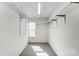 Walk-in closet with wire shelving, carpet, and natural light from a window at 9900 Meadowmead Ct, Charlotte, NC 28273