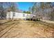 The backyard features a deck, is partially fenced, and has space for gardening and recreation at 1049 Ramsey St, Stanley, NC 28164