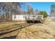 The backyard features a deck, is partially fenced, and has space for gardening and recreation at 1049 Ramsey St, Stanley, NC 28164
