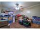 Basement featuring carpet, ceiling fan, and boxes throughout at 1049 Ramsey St, Stanley, NC 28164