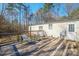 Back deck with seating offers a serene outdoor space, great for relaxing and entertaining at 1049 Ramsey St, Stanley, NC 28164