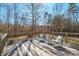 Back deck with seating offers a serene outdoor space, great for relaxing and entertaining at 1049 Ramsey St, Stanley, NC 28164
