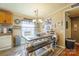 Eat-in kitchen dining area, ample lighting and farmhouse-style decor at 1049 Ramsey St, Stanley, NC 28164