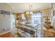 Eat-in kitchen dining area, ample lighting and farmhouse-style decor at 1049 Ramsey St, Stanley, NC 28164