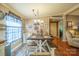 Eat-in kitchen dining area, ample lighting and farmhouse-style decor at 1049 Ramsey St, Stanley, NC 28164