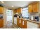 Functional kitchen boasts ample cabinet space and access to laundry area at 1049 Ramsey St, Stanley, NC 28164