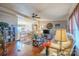 Open concept living room with hardwood floors flowing into dining area with lots of natural light at 1049 Ramsey St, Stanley, NC 28164