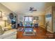 Bright living room with hardwood floors, ceiling fan, and stylish decor at 1049 Ramsey St, Stanley, NC 28164