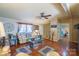 Comfortable living room featuring neutral tones, ceiling fan, and hardwood flooring at 1049 Ramsey St, Stanley, NC 28164