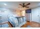 Cozy main bedroom featuring neutral walls, hardwood flooring, and ensuite bathroom at 1049 Ramsey St, Stanley, NC 28164