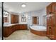 This luxurious bathroom features dual sinks, ample cabinet space, and a jacuzzi tub for relaxation at 109 Fish Hill Dr, Statesville, NC 28677