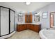 Bright bathroom featuring double vanity, walk-in shower, and large soaking tub at 109 Fish Hill Dr, Statesville, NC 28677