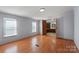 Spacious bedroom with hardwood floors, natural light, and an adjoining bathroom for added convenience at 109 Fish Hill Dr, Statesville, NC 28677