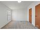 Cozy bedroom with plush carpeting, natural light, and two closets at 109 Fish Hill Dr, Statesville, NC 28677