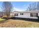 Wide view of the home's vinyl siding and black shutters on a clear day at 109 Fish Hill Dr, Statesville, NC 28677