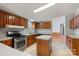 This spacious kitchen showcases wood cabinets, stainless steel appliances, and a functional island for meal prep at 109 Fish Hill Dr, Statesville, NC 28677