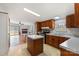 Well-lit kitchen features an island, stainless steel appliances, and wood cabinets at 109 Fish Hill Dr, Statesville, NC 28677