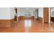 An open living space with beautiful wood-look flooring and chair rail provides a cozy feel at 109 Fish Hill Dr, Statesville, NC 28677