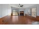 Inviting living room featuring a cozy fireplace and sliding door access to the outdoor deck area at 109 Fish Hill Dr, Statesville, NC 28677