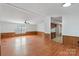 Open living room features wood-look floors and neutral walls with chair rail at 109 Fish Hill Dr, Statesville, NC 28677