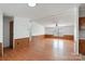 An open living space with beautiful wood-look flooring and chair rail provides a cozy feel at 109 Fish Hill Dr, Statesville, NC 28677