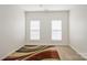 Bright bedroom features neutral walls, carpet and a colorful area rug at 1116 Crooked River Dr, Waxhaw, NC 28173