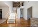 Bright foyer features a staircase with wooden banister and iron spindles, leading to the second floor at 1116 Crooked River Dr, Waxhaw, NC 28173