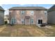 Back exterior of home with patio, sliding glass door, and green space at 1189 Sandy Bottom Nw Dr, Concord, NC 28027