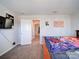 A well-lit bedroom with a bed, carpet, TV, and decorative posters, creating a personalized and cozy space at 1232 Scotch Meadows Loop, Monroe, NC 28110